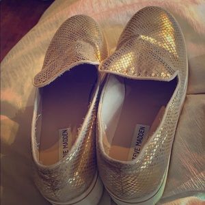 Gold snake skin sneakers with wedge